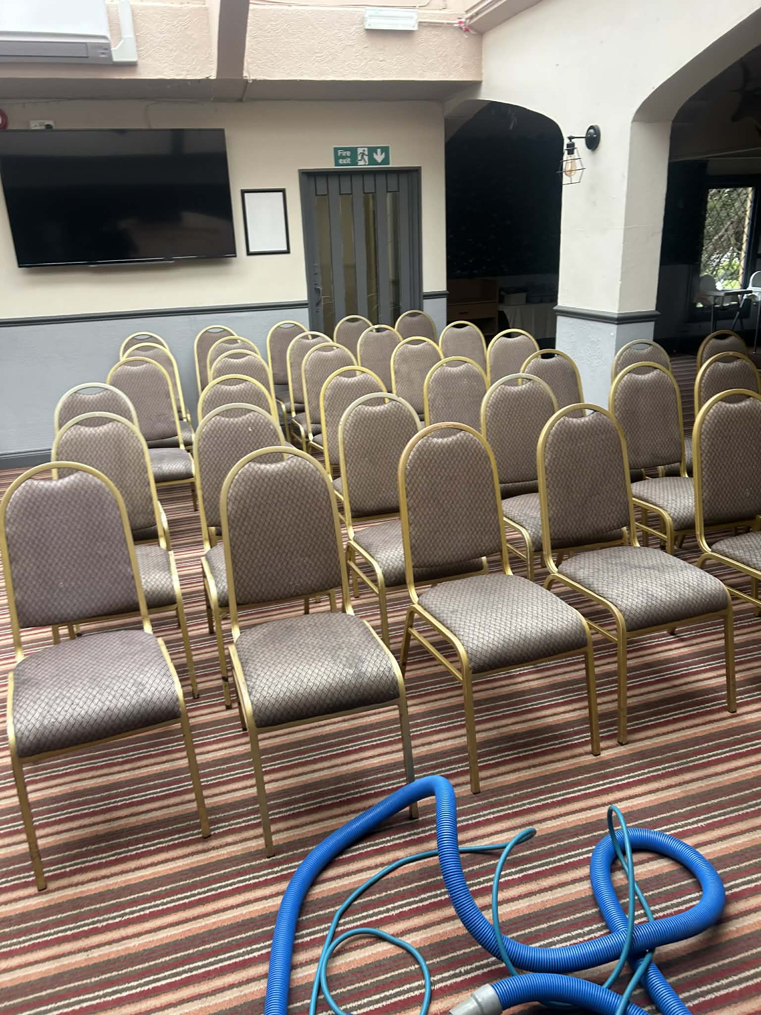 Close up of commercial patterned carpet before and during professional cleaning